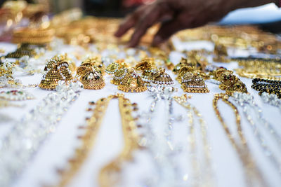 Close-up of jewelry on table for sale in store