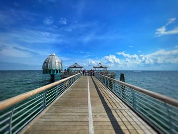 Pier over sea against sky