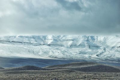 Scenic view of snowcapped landscape against sky