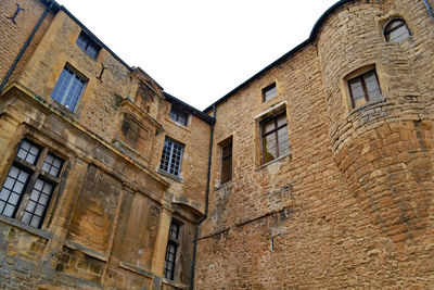 Low angle view of old building against clear sky