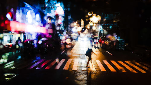 Illuminated city street at night