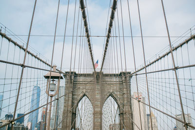 Low angle view of brooklyn bridge against sky