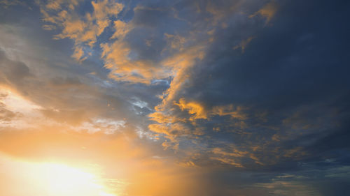 Low angle view of dramatic sky during sunset