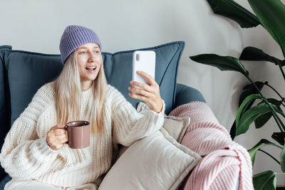 Portrait of woman using mobile phone