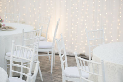 Empty chairs and tables in restaurant