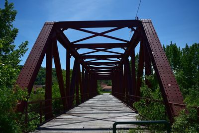 View of footbridge against sky