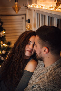 Portrait of young couple kissing