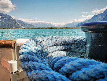 High angle view of boat in lake and mountains 