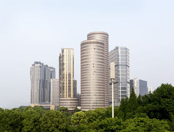 Modern buildings against clear sky in city