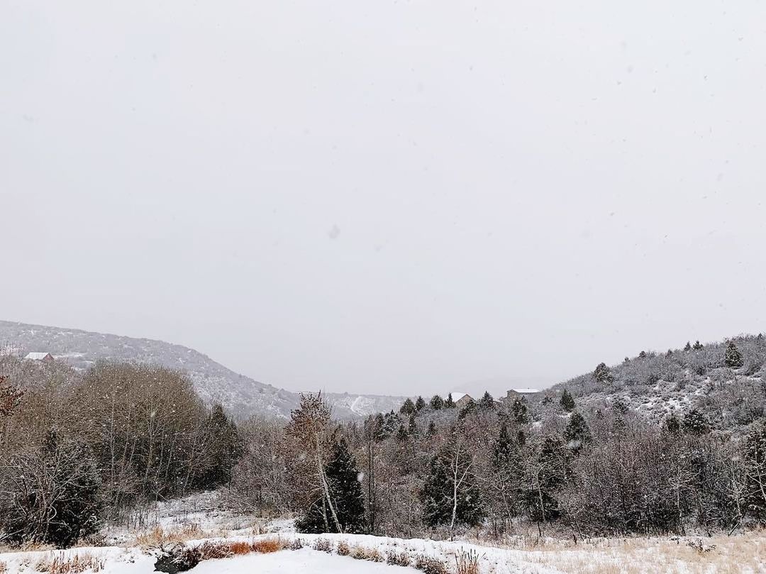 SNOW COVERED LAND AGAINST SKY