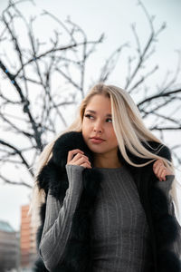 Portrait of a beautiful young woman in winter