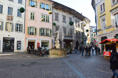 People walking on street in city