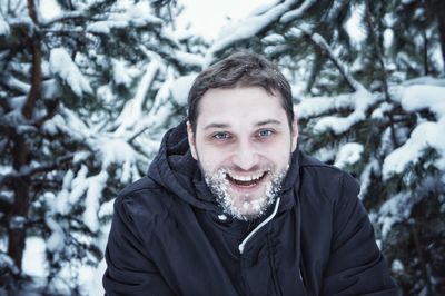 Portrait of smiling young man during winter