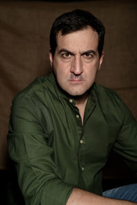 Portrait of man sitting outdoors