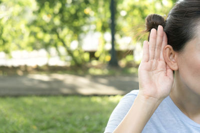 Close-up of woman hand holding plant