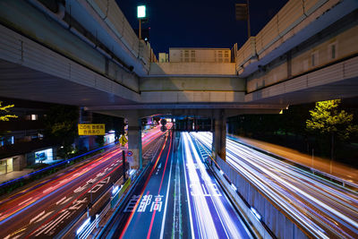 High angle view of light trails on road at night