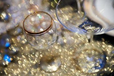 Close-up of illuminated lamp on table