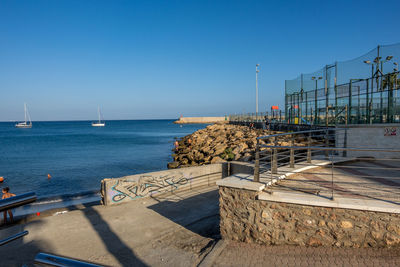 Scenic view of sea against clear blue sky