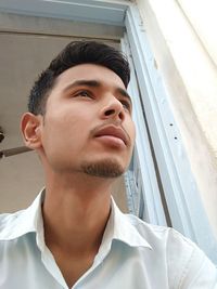 Portrait of young man looking away