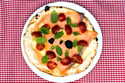 Close-up of pizza in plate on table