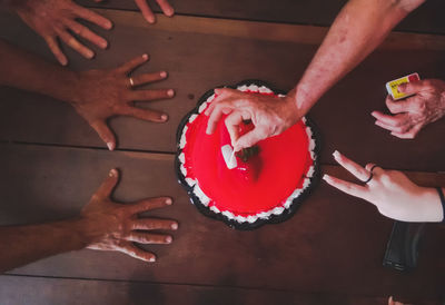 High angle view of man hand holding ice cream