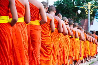 Monks standing in row