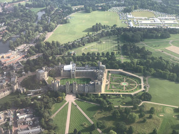 High angle view of trees and buildings in city