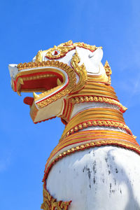 Low angle view of statue against sky