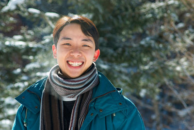 Portrait of a smiling man in snow