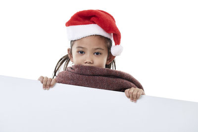Portrait of cute baby boy against white background