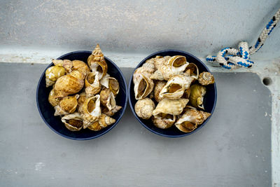 High angle view of animal shells in bowls