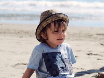 Boy sitting on beach