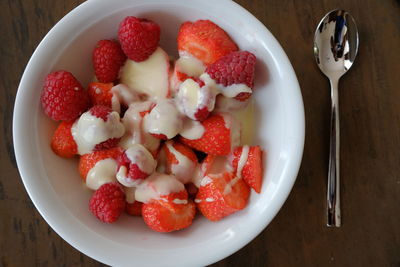 High angle view of strawberries in bowl on table