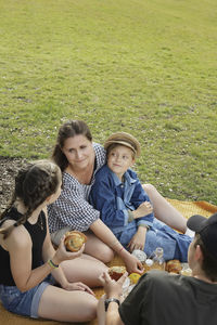 Mother having picnic with children