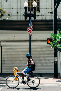 Bicycle on street against blue sky