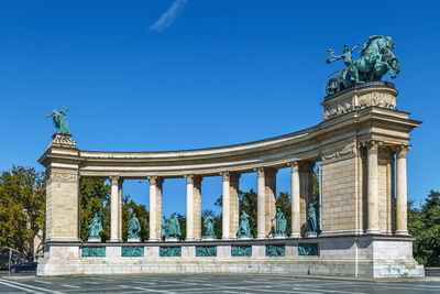 Millennium monument on heroes' square in budapest, hungary. colonnade with statues.