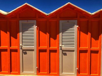 Exterior of house against orange sky on sunny day