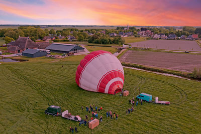 Aerial from a hot air balloon ready to take off in the netherlands at sunset