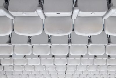 Full frame shot of empty chairs at stadium 