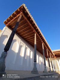 Low angle view of building against clear blue sky