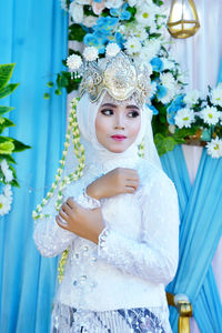 
young woman posing in traditional bridal attire