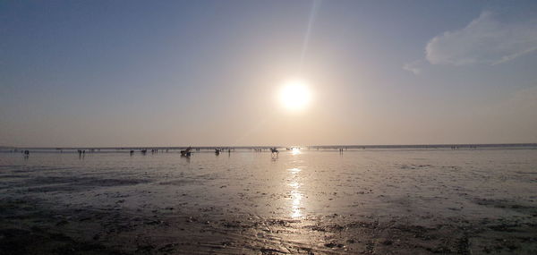 Scenic view of sea against sky at sunset