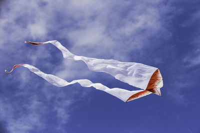 Low angle view of flag against sky