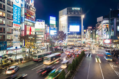 Light trails on road in city at night