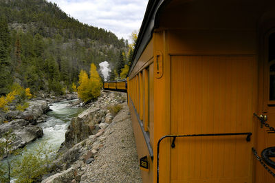 Train on railroad track against sky