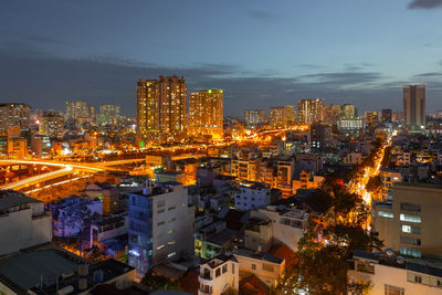 Illuminated buildings in city at night