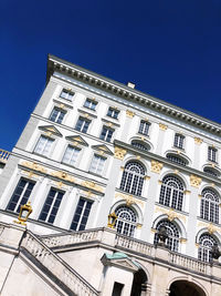 Low angle view of building against blue sky