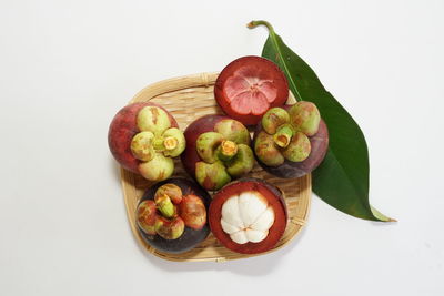 High angle view of fruits on white background