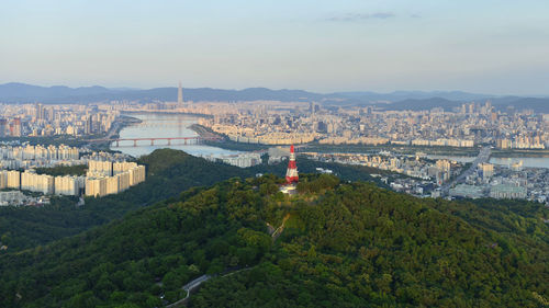 High angle view of buildings and mountains against sky