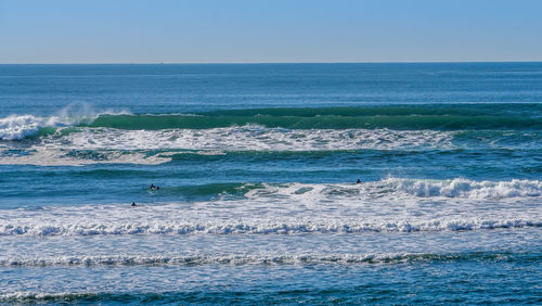 Waves suitable for surfing roll in at westport, washington.